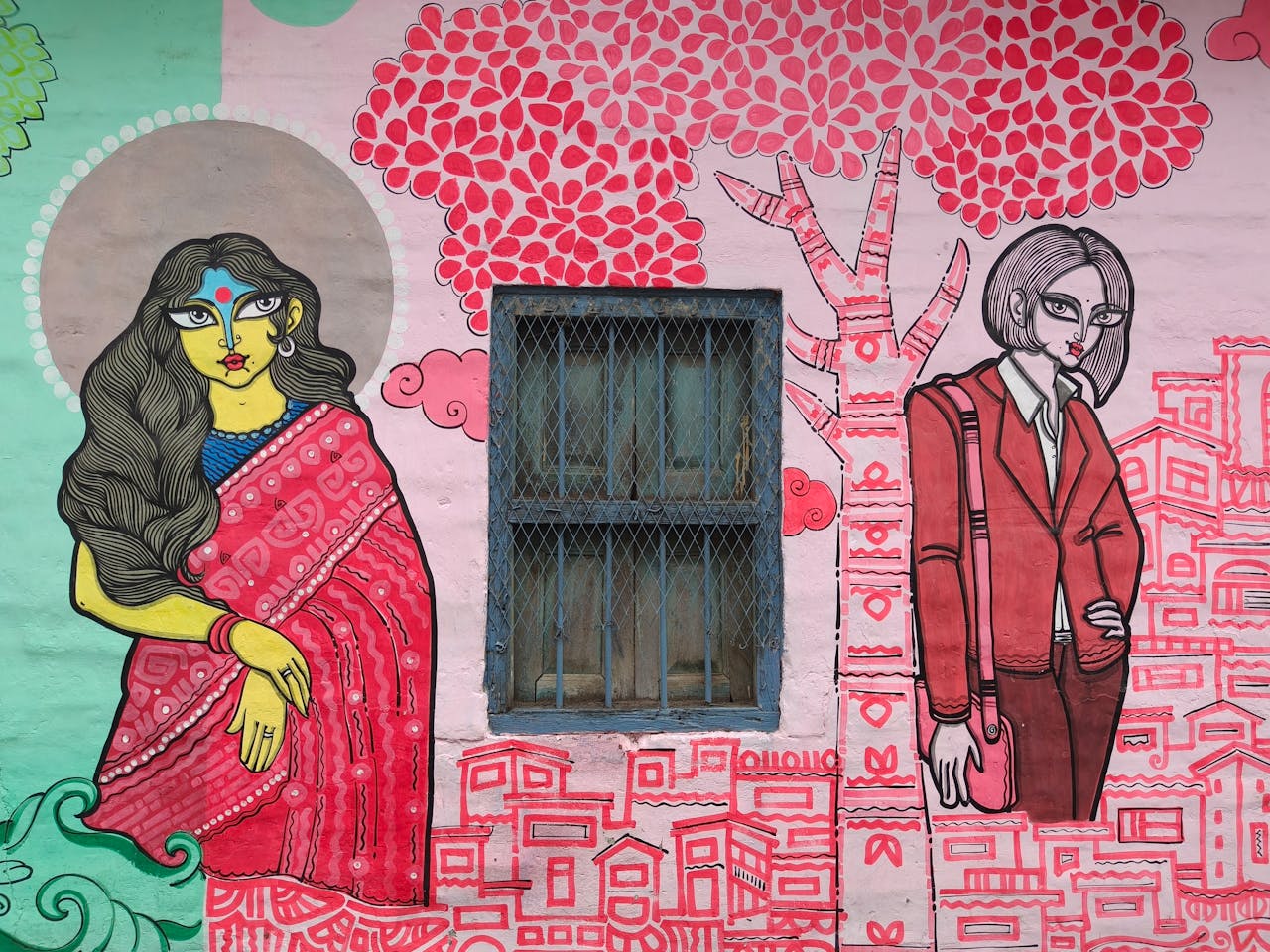 services-02 Colorful street art depicting characters on a wall in Kolkata, India.